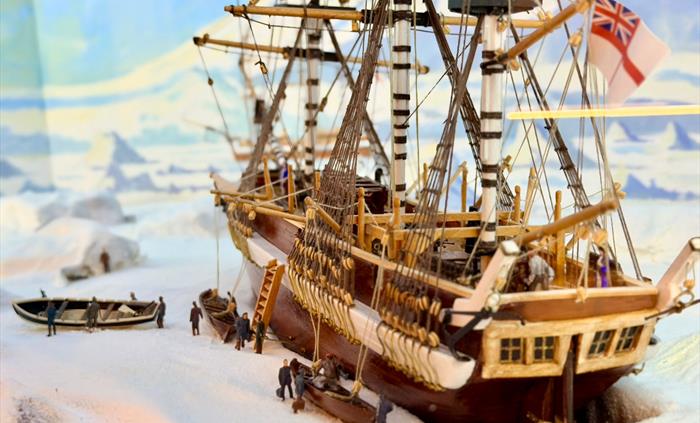 Diorama of HMS Erebus exploring the Antarctic, with the newly names Mt Erebus in the background